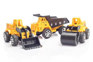 Heavy Construction Machinery Toy on white background.