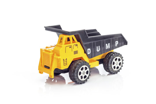 Yellow toy dump truck isolated on white background