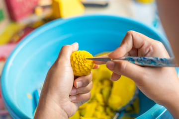 Woman's hand carved pumpkin flowers.