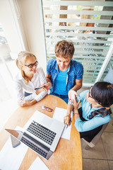 Obraz premium Multiracial company. Three people of different nationalities work