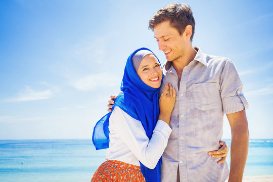 Happy Muslim Couple On A Beach