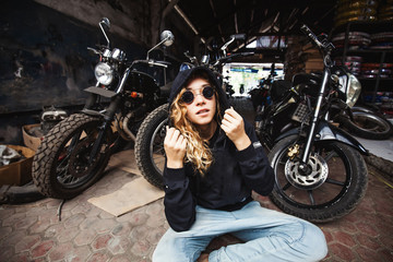 urban style girl in a grunge garage