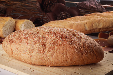 wheat bread isolated on wooden background