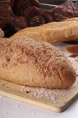 wheat bread isolated on wooden background