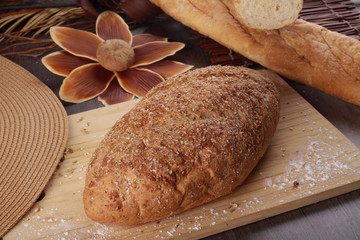 wheat bread isolated on wooden background