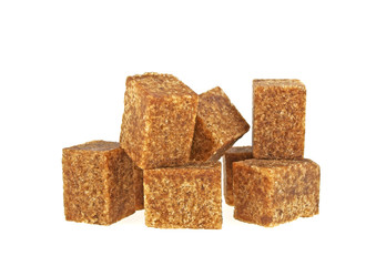 Brown sugar cubes on a white background