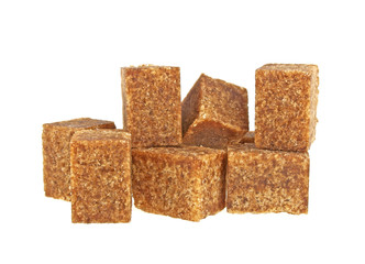 Brown sugar cubes on a white background