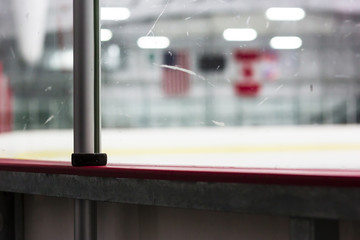 American and Canadian flags at an ice hockey rink