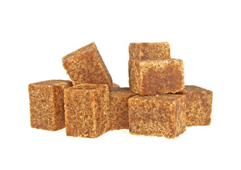 Brown sugar cubes on a white background