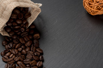 Heap coffe beans on dark stone