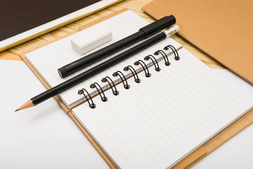 White open notebook on beech wood background
