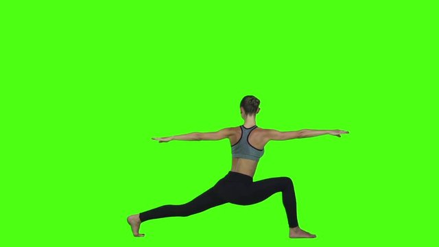 Healthy and slim woman doing yoga. Green screen. Slow motion