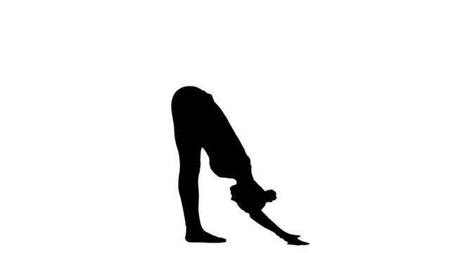 Woman meditating in yoga pose silhouette. White. Slow motion. Silhouette