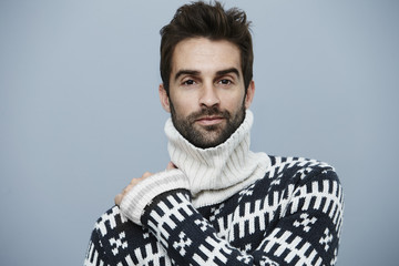 Fototapeta premium Posing handsome guy in woolen sweater