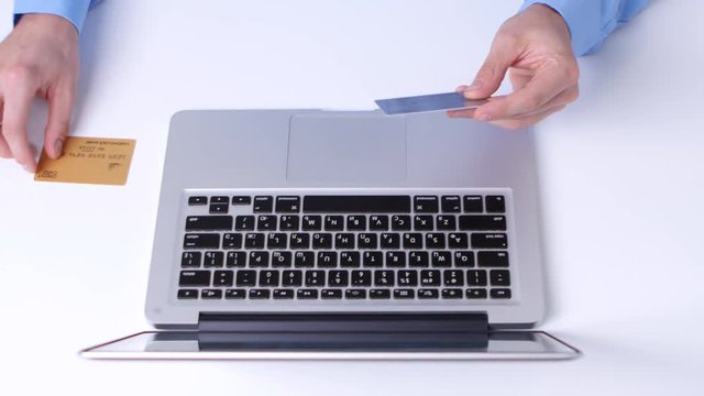 Online shopping with many different credit cards. Close up