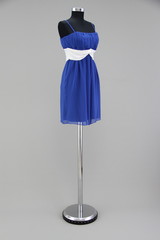 Blue dress on a model stand against a gray background - 123987726