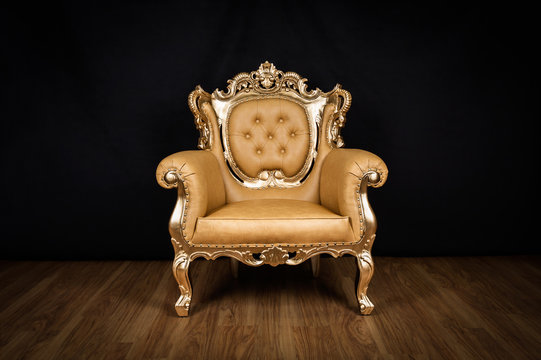 Antique armchair / throne with golden ornaments
