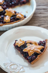 Portion of mince pie on the wooden background