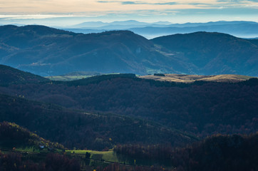 Rolling hills and mountains at autumn sunny day, view from Bobija mountain, Serbia