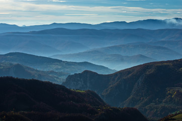 Rolling hills and mountains at autumn sunny day, view from Bobija mountain, Serbia