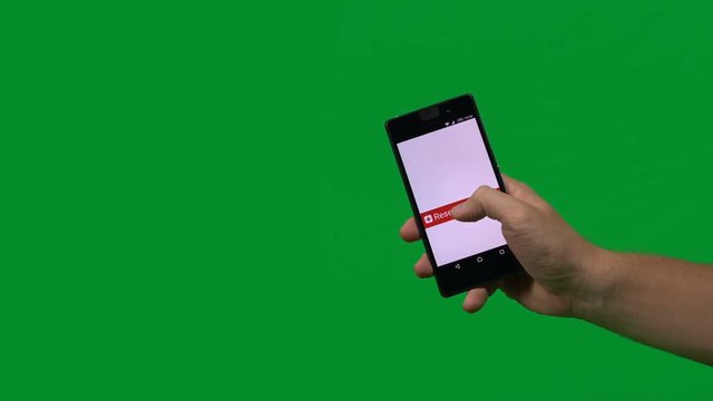 Man holding a phone on greenscreen pressing Reserve Your Seat button - simply replace the green with your website or event photo or video using keylight and use this clip as a call to action.