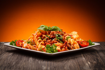 Pasta with meat, tomato sauce and vegetables
