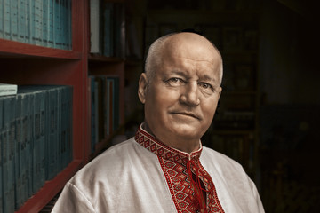 Portrait of a man in the Ukrainian national shirt -  background
