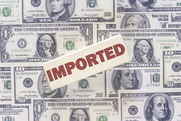 Financial concept with Imported sign on dollar bills