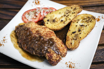 chicken schnitzel with potato and gravy meal