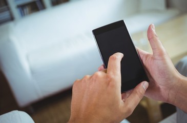Mans hands using mobile phone