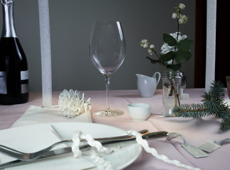 elegant table setting. Christmas. romantic dinner - tablecloth, cutlery, candles, flowers, buds.