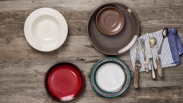 timelapse with table set with retro pottery, old silverware and vegetables