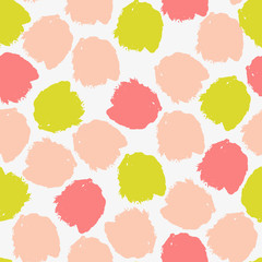 Abstract seamless pattern with brush strokes in green, peach and pink.