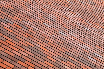 Orange brick wall, background, diagonal position, texture,