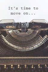 It's time to move on motivational message written with a vintage typewriter
