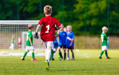 Obraz na płótnie Canvas Young Soccer Goalie Goalkeeper. Young Boy Soccer Goalie. Youth Sports Soccer Football Background
