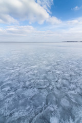 Fototapeta na wymiar winter frozen lake / winter peaceful landscape deserted place
