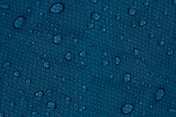 Water drops on a dark blue background. Abstract background.