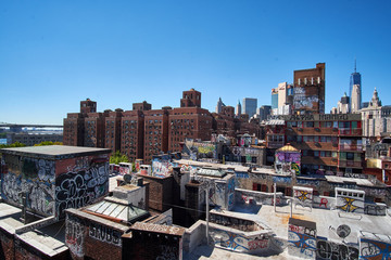NEW YORK CITY - SEPTEMBER 25, 2016: Overlooking rooftops painted with a lot of graffiti on the...