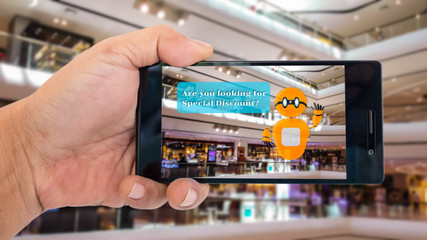 Augmented reality application for retail business concept. Hand holding smart phone with A/R application on screen to scanning discount  in Department store. Represent A/R application in business.