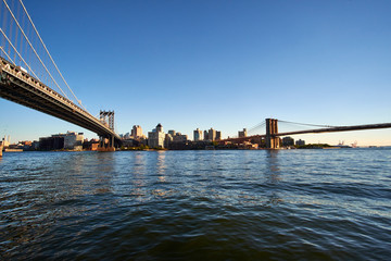 Standing between the Manhattan and Brooklyn Bridge looking over the East River from the area Two Bridges on Manhattan