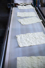 Pita on the production line at the bakery