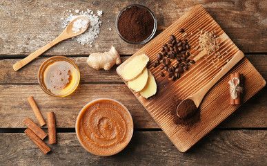 Natural ingredients for homemade scrub on wooden background