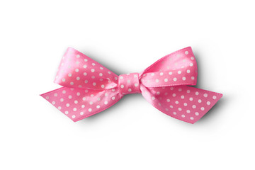 Beautiful pink bow with polka dot pattern on white background