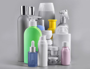 Set of body care products on grey background