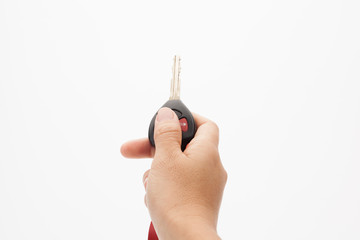 Hand with car keys isolated on white.