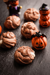 Eclairs with halloween decoration on black background