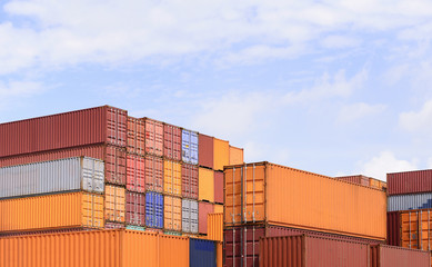 The stack of container storage on the ship yard before export process.The container storage with the sky.