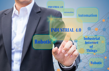 Industrial 4.0 concept. Business man pointing to  virtual banner with Industrial 4.0 word and its components.