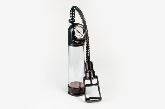 Penis pump sex toy on white background
